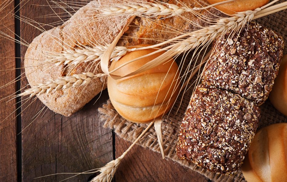 Assortment of baked bread on a wooden table