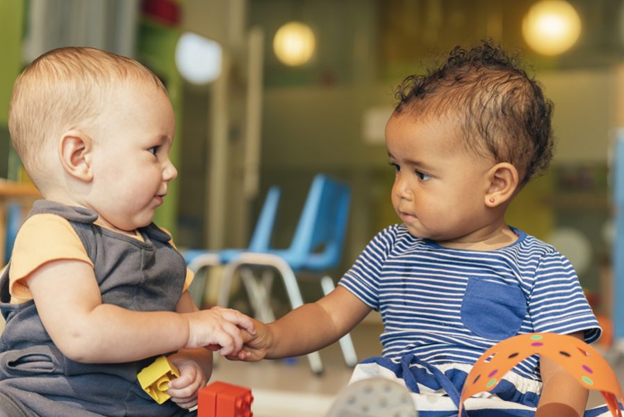 Babys playing together in the kindergarten.