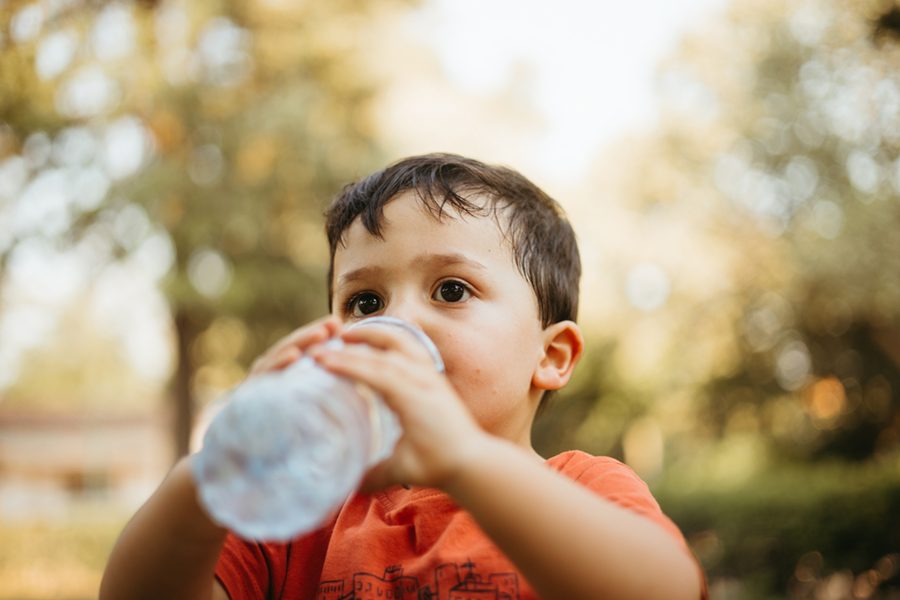 child-drinking-water-from-bottle