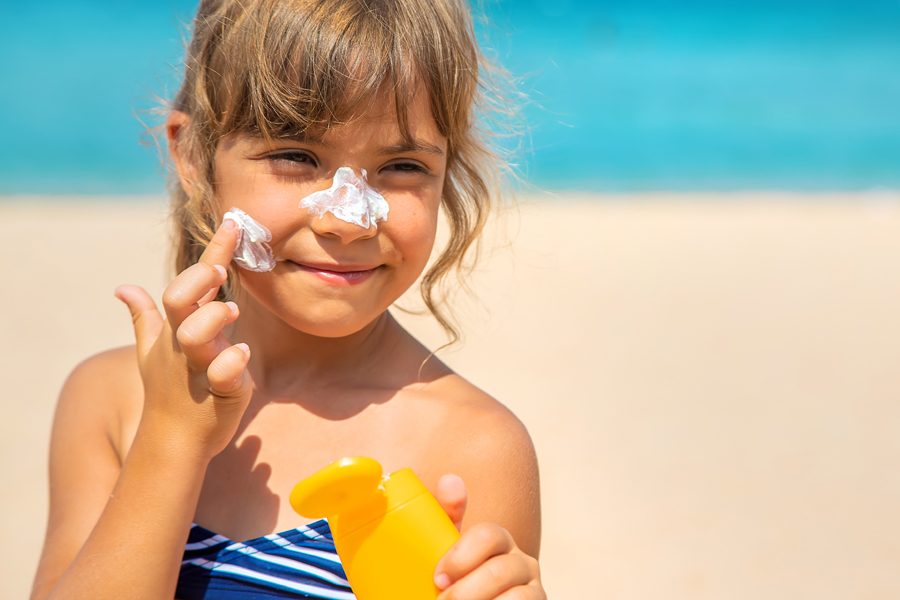 Sunscreen on the skin of a child. Selective focus. nature.