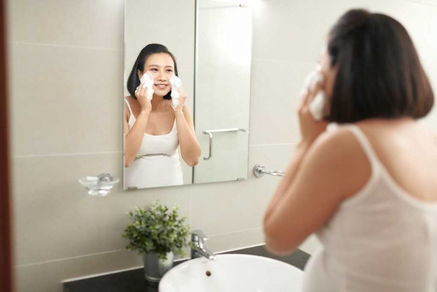 f-beautiful-pregnant-woman-washing-her-face-bathroom-RD