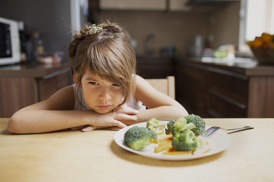 front-view-picky-girl-refuse-vegetables