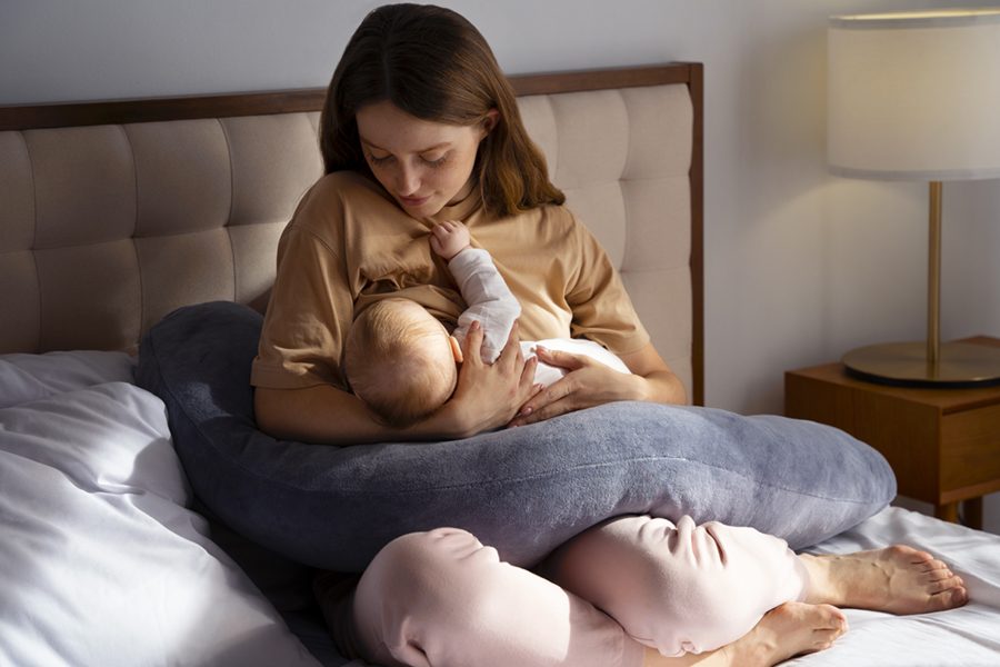 full-shot-mother-with-cute-newborn