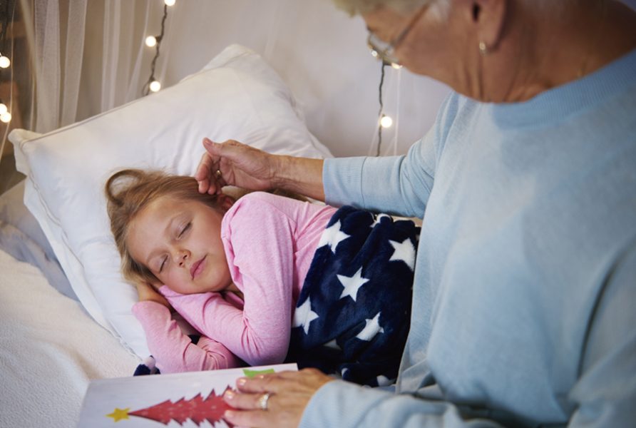 Grandmother caressing granddaughter's face