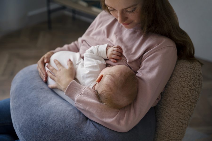 high-angle-mother-with-cute-newborn