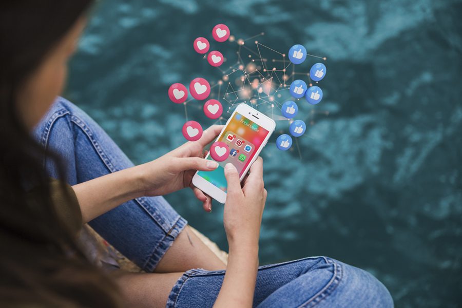 high-angle-woman-holding-smartphone