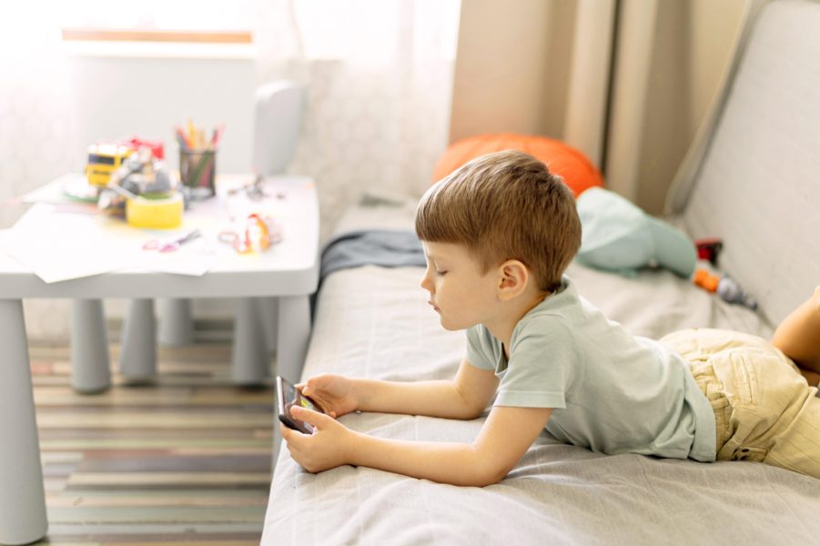 medium-shot-boy-laying-sofa