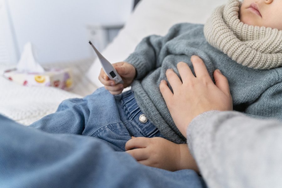 mom-taking-care-her-child-teleconsulting-with-doctor