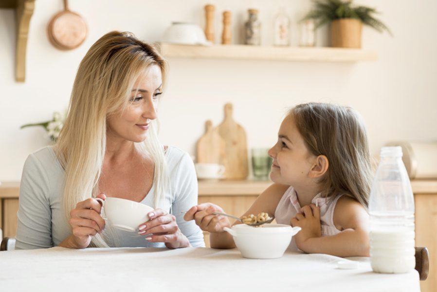 mother-daughter-eating-breakfast-together