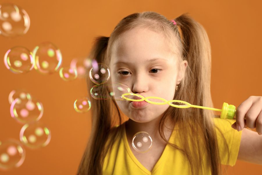 portrait-cute-young-girl-blowing-bubbles