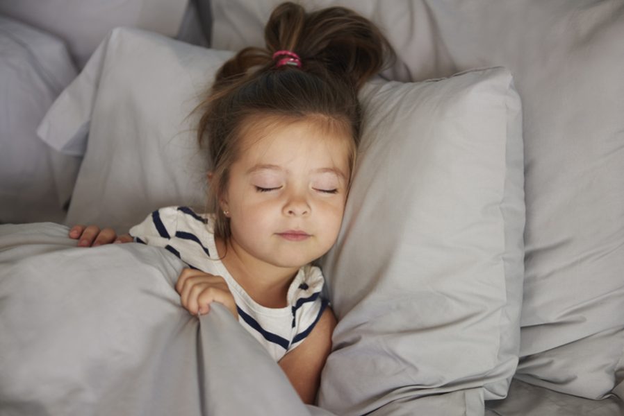 Sleeping girl in the bed