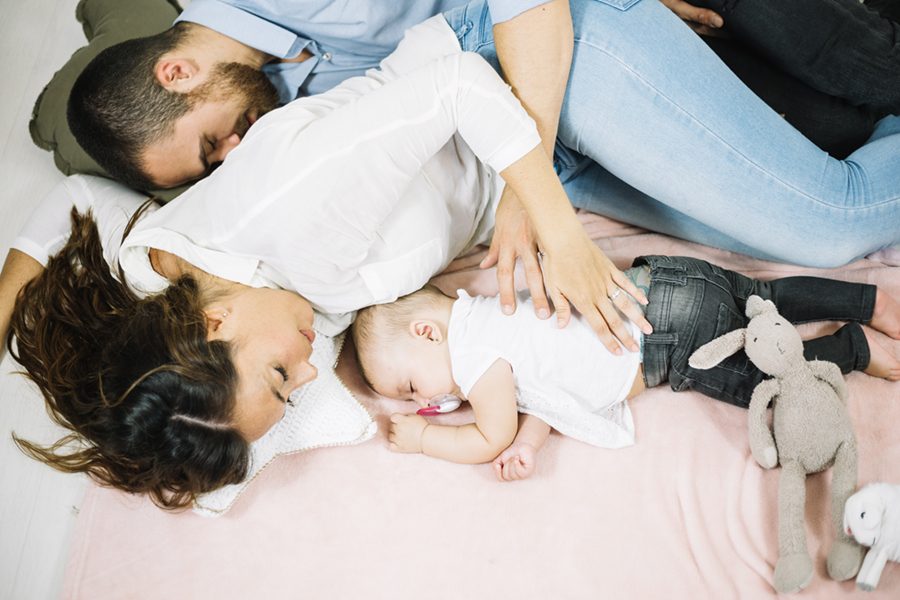 sleeping-man-embracing-wife-baby