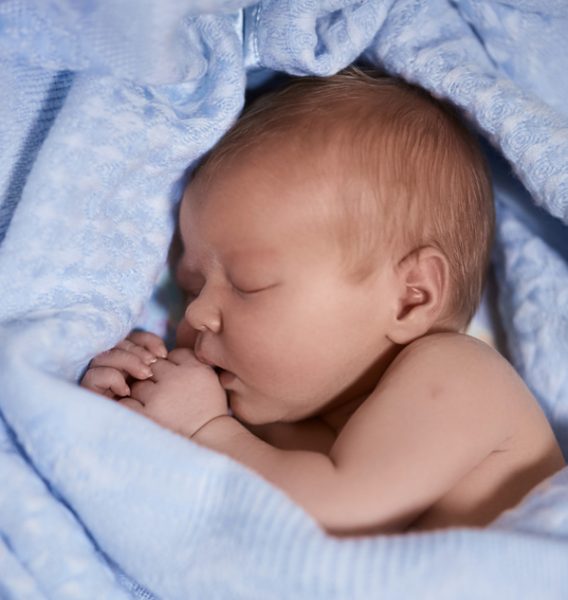 Sleeping newborn baby. Cute little boy who is 4 days old. Baby up to a week old