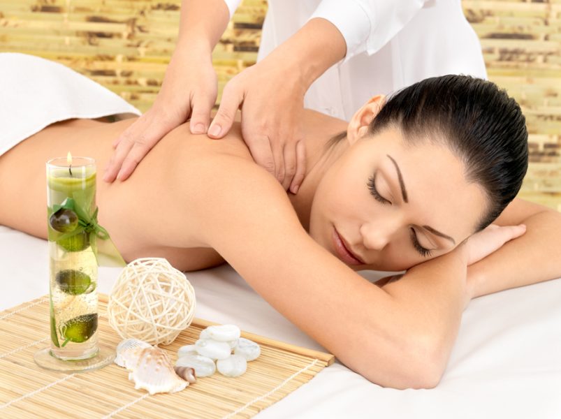 Woman having massage of body in the spa salon. Beauty treatment concept.