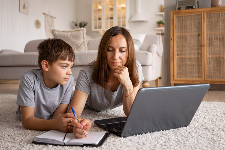 woman-working-from-home-with-kid-front-view